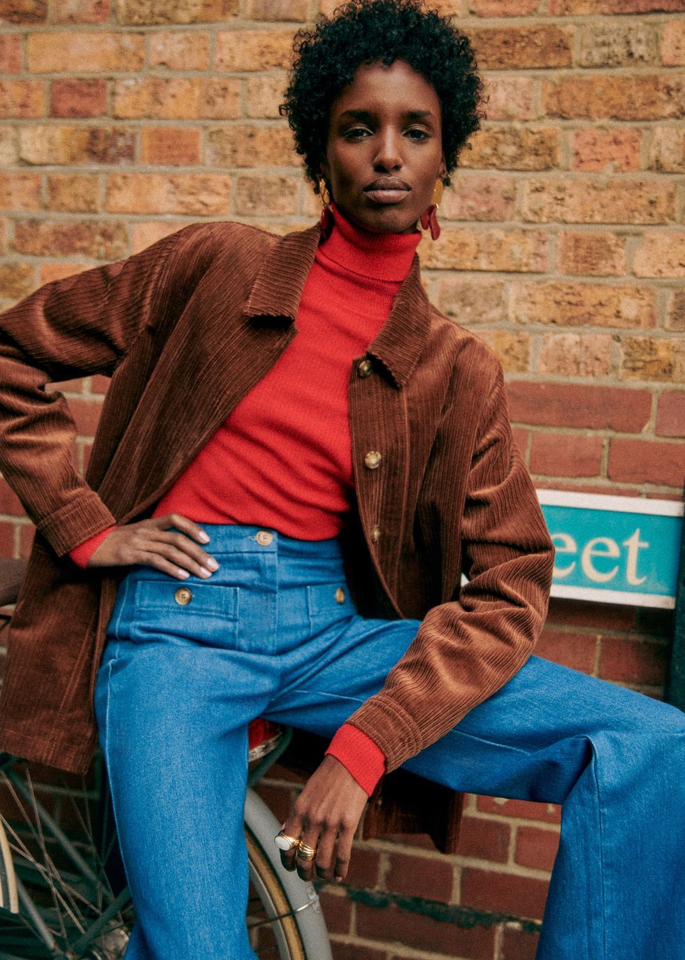 a woman sitting on a bicycle